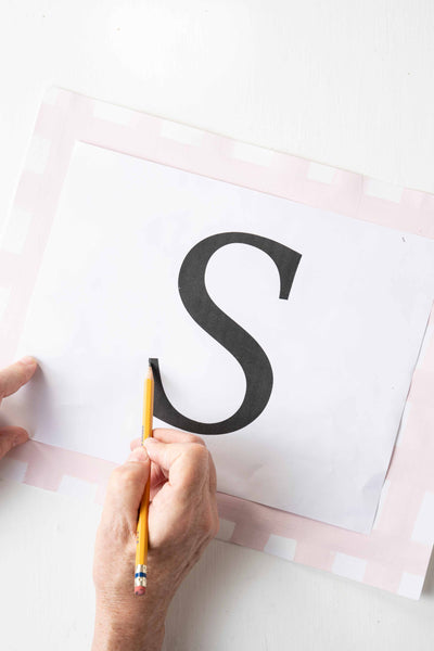 Creating an S monogram on the placemat.