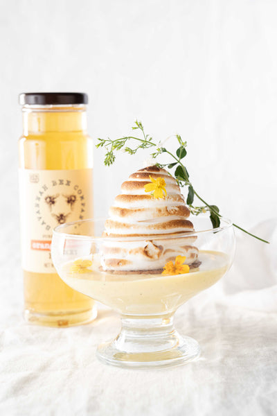 Beehive meringues with orange blossom honey bottle