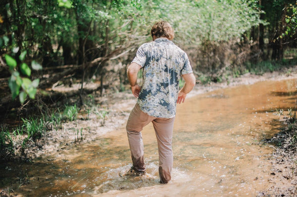 Savannah Bee Founder Ted Dennard walking in the tupelo swamp