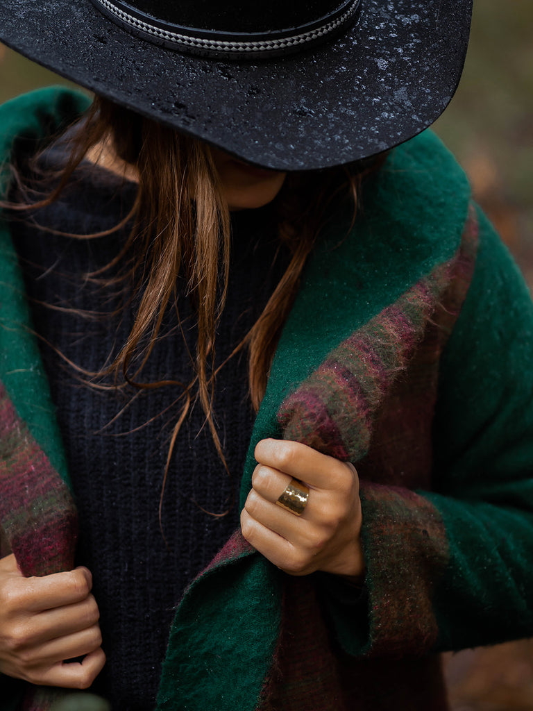 Woman wearing the Western Wrap for Women in Green and Blue with a Black Cowboy hat