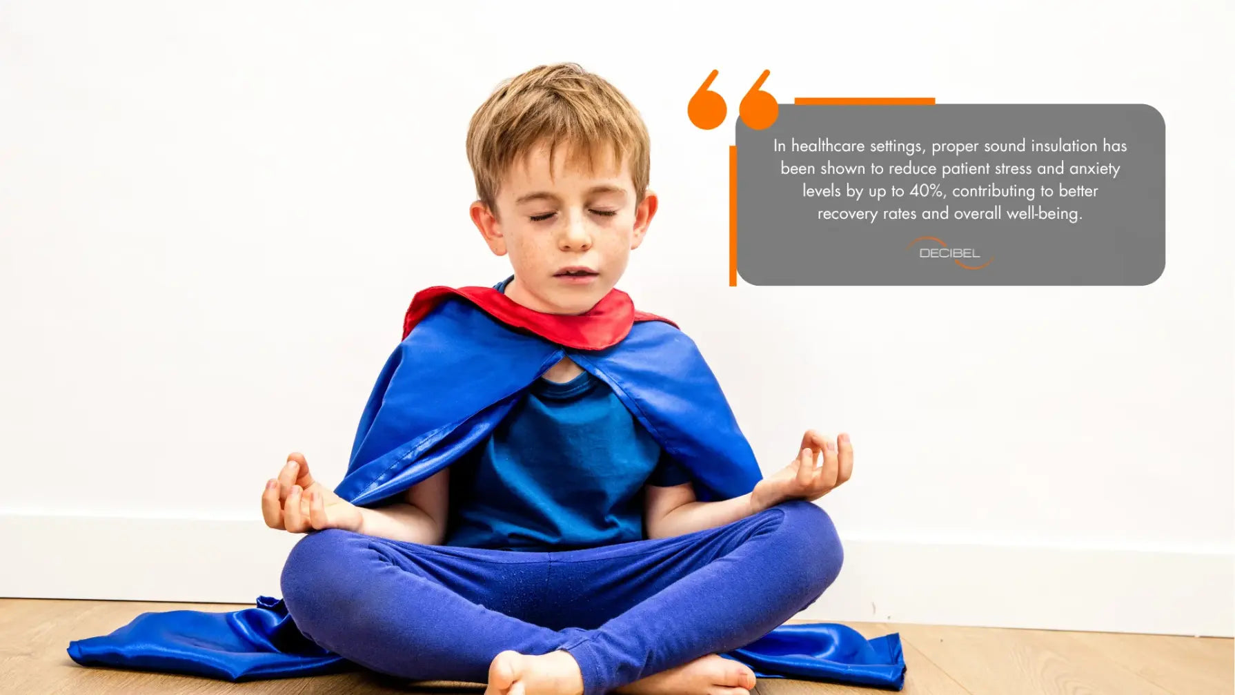 sound-insulation-healthcare-buildings-blog-article-DECIBEL-little-boy-meditating-superman-costume