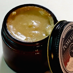 An open jar of water-based pomade