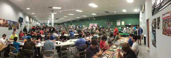 A crowded game room during an event at Atomic Empire