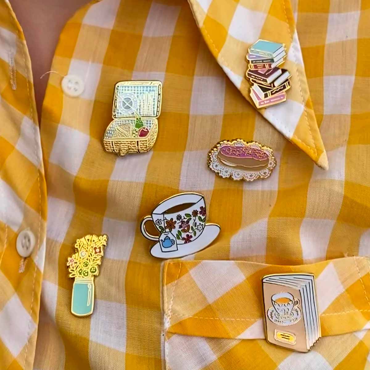 RO x Cheryl Orisini pins on yellow gingham shirt