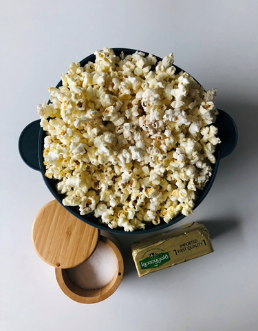 Popcorn with butter and salt in a silicone popcorn maker