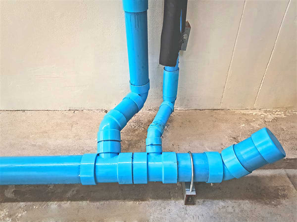 c900 PVC Pipe running along wall