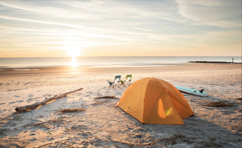 A TETON Sports Mountain Ultra Tent is set-up on a deserted beach at dawn.