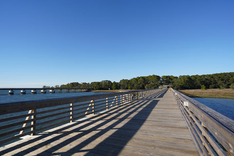 A view of a long fishing dock inside Hunting Island State Park.
