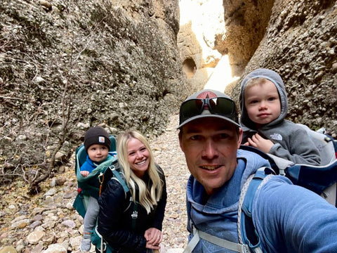 A family of four backpacking inside of a canyon with TETON Sports backpacks on.