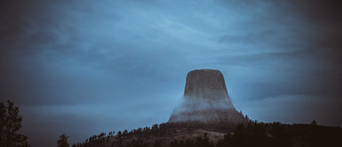 A dark and moody view of a mountain peak.