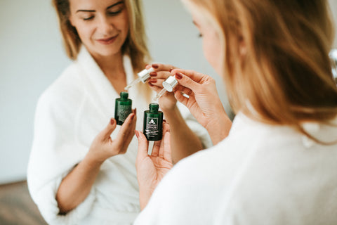 woman using one of our totally natural face oils