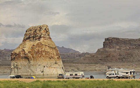 RV campers near large rock formation