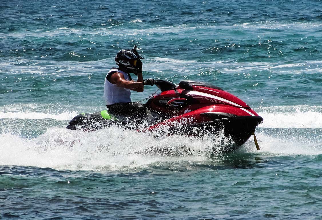 Red Jet ski with performance image