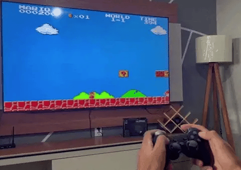 Guy playing GameStick Retro Video Game Console