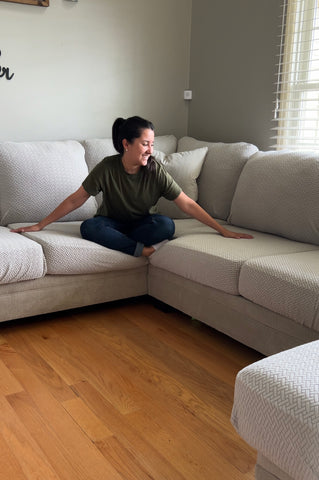 women sitting on a couch with couch covers