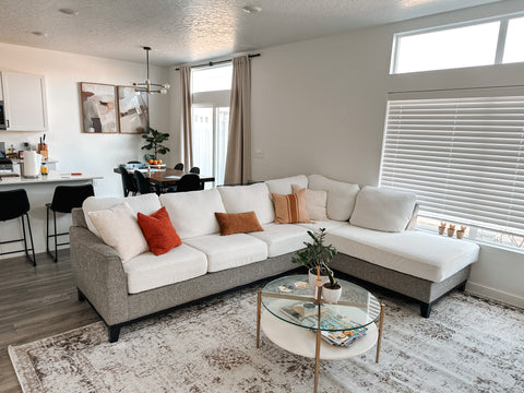 living room with section couch with couch covers