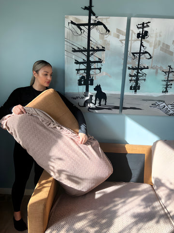 woman installing couch cover