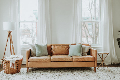 beige sofa with textured rug
