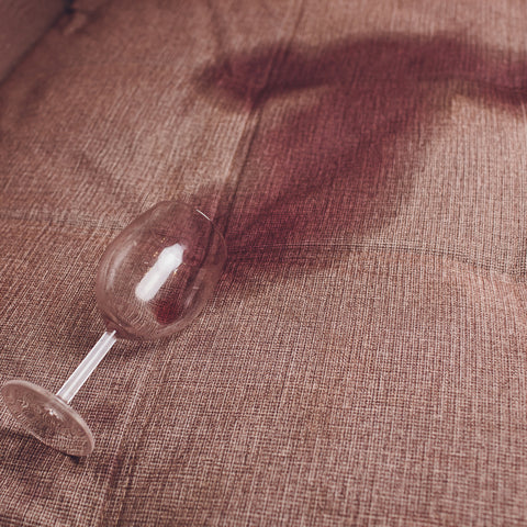 red wine spilled on a couch