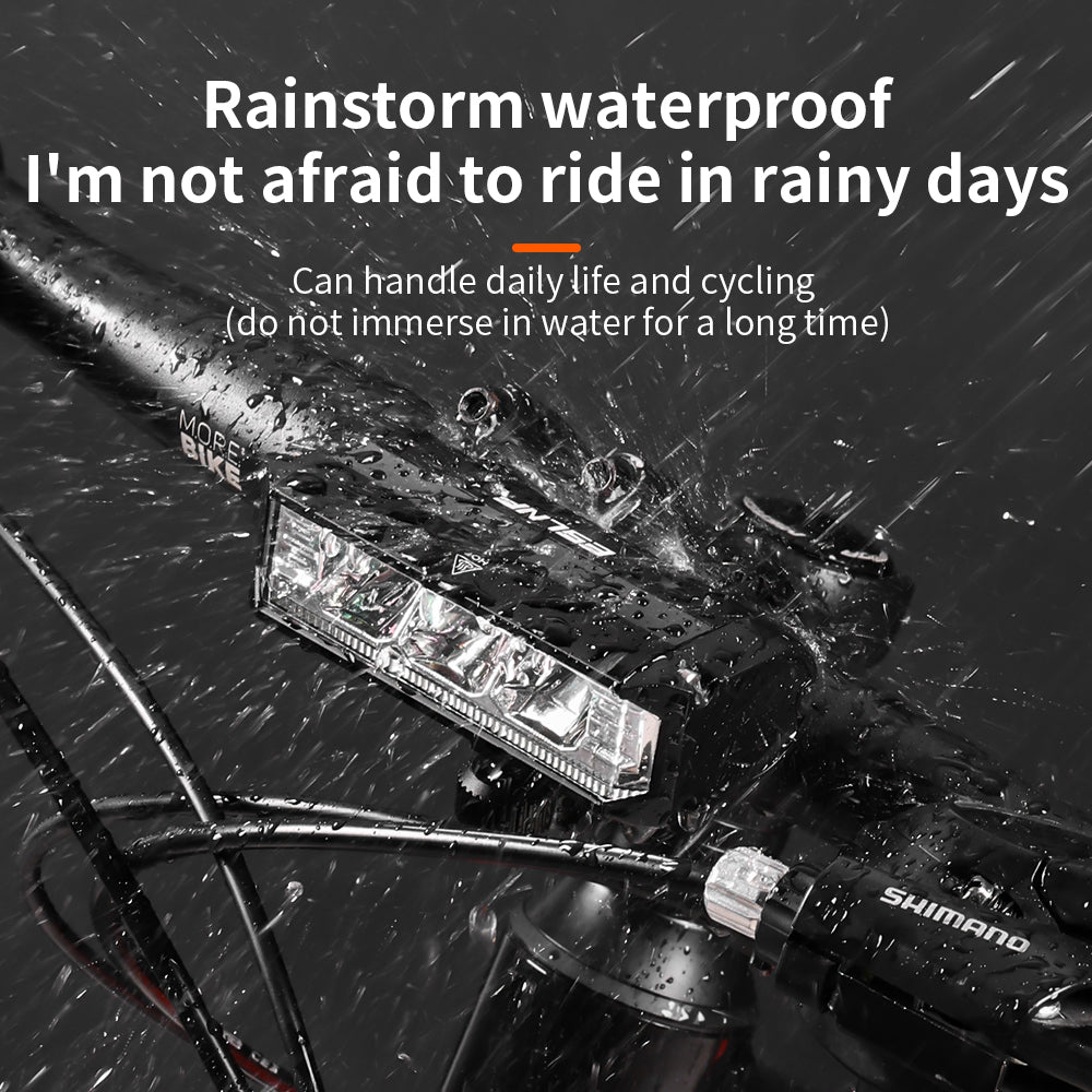 Waterproof LED Bike Lights - Cyclist riding in rainy weather with waterproof LED bike lights.