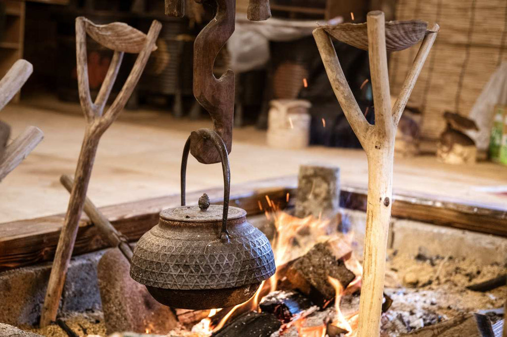 ancient Japanese food being cooked in a cooking bowl outdoor 