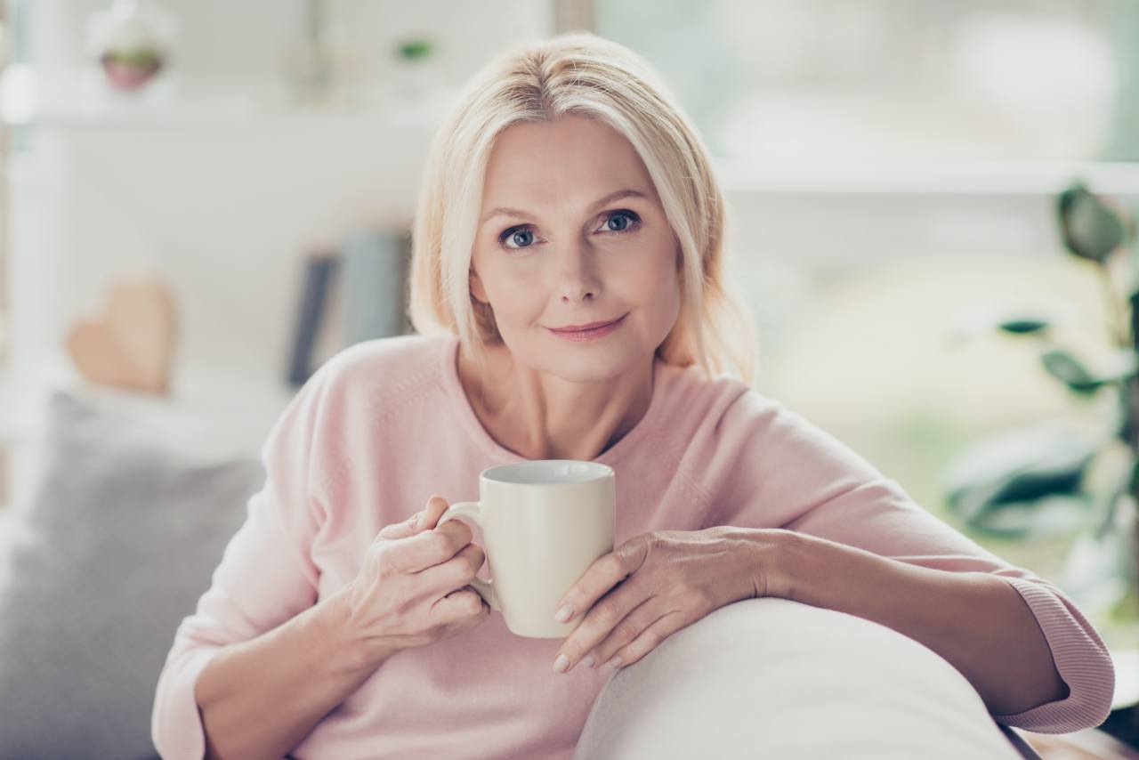 Modern, stylish, caucasian, aged, woman having cup of bone broth