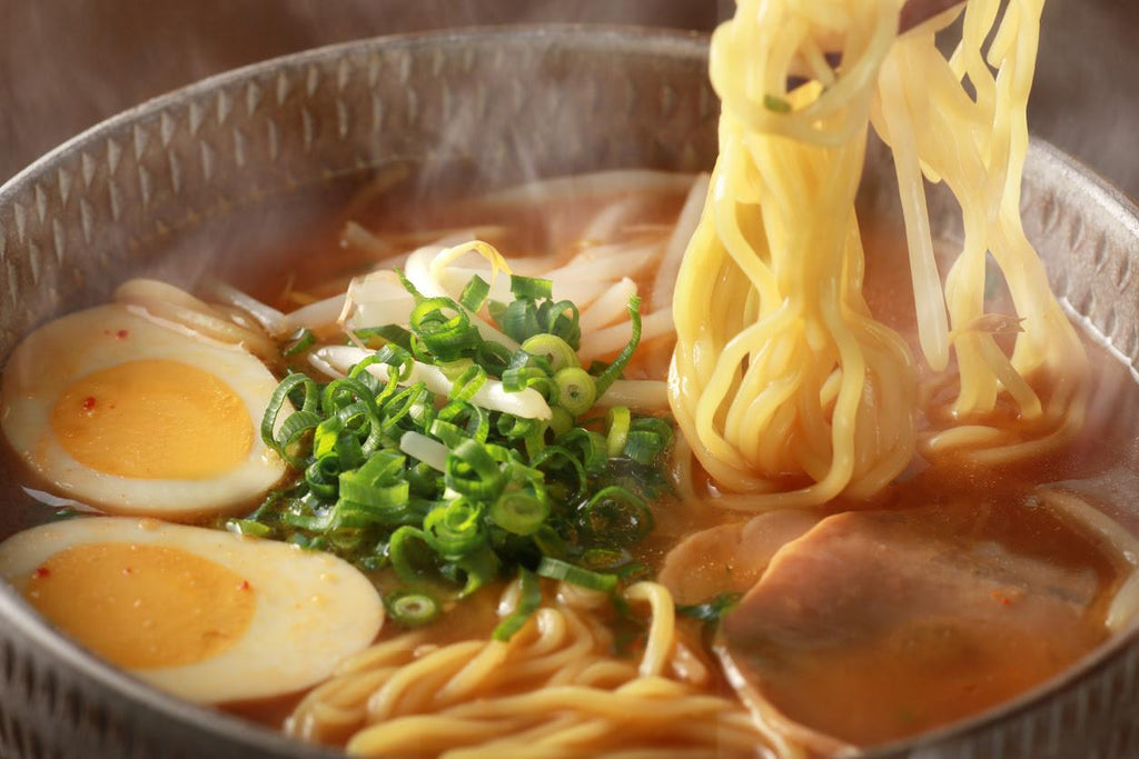 ramen with vegetable broth in a bowl