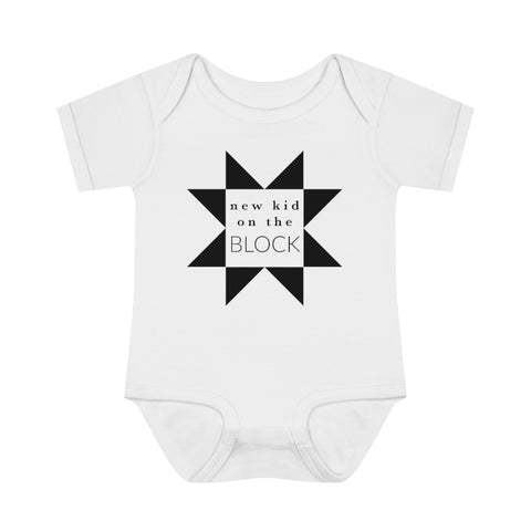 White short sleeve "new kid on the block" onesie with black ink