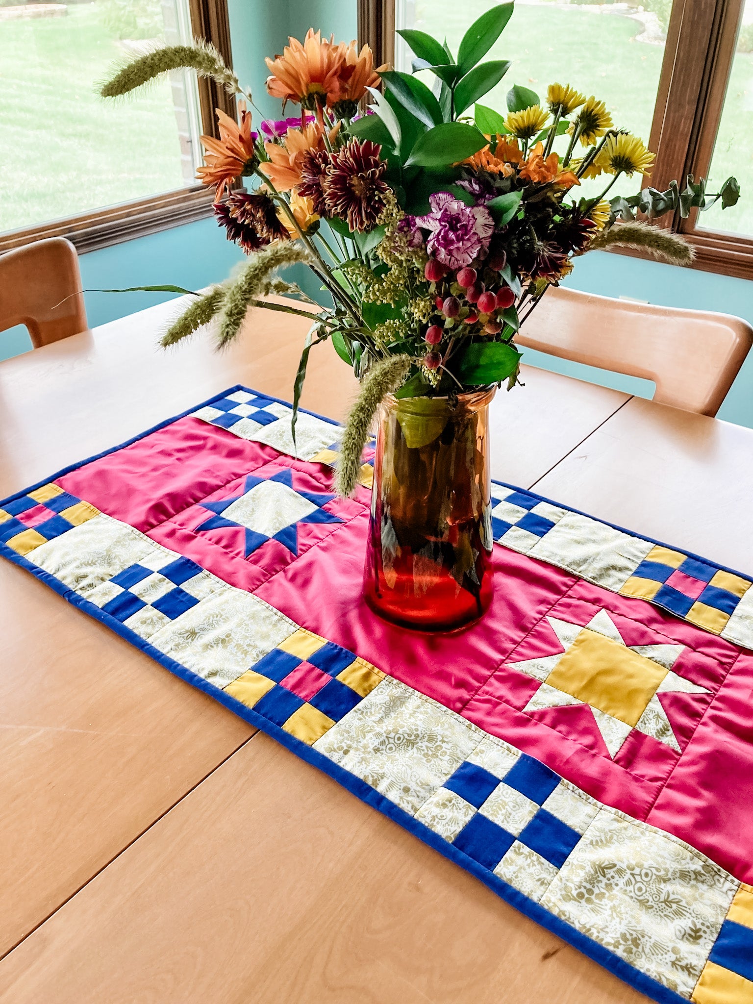 alaina's pockets full of blessings table runner with a bouquet of flowers