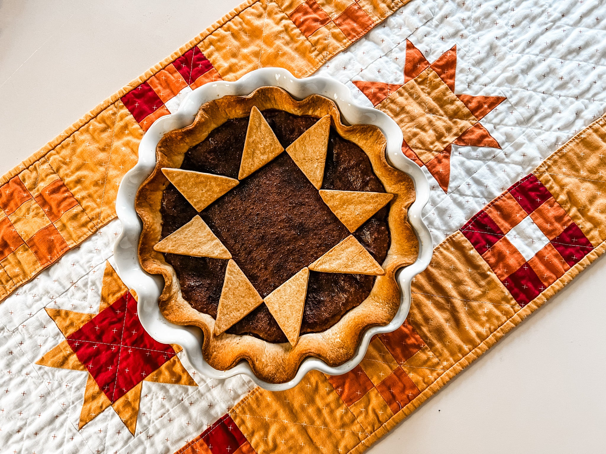 fudge pie with quilted top crust over pockets full of blessings quilted table runner