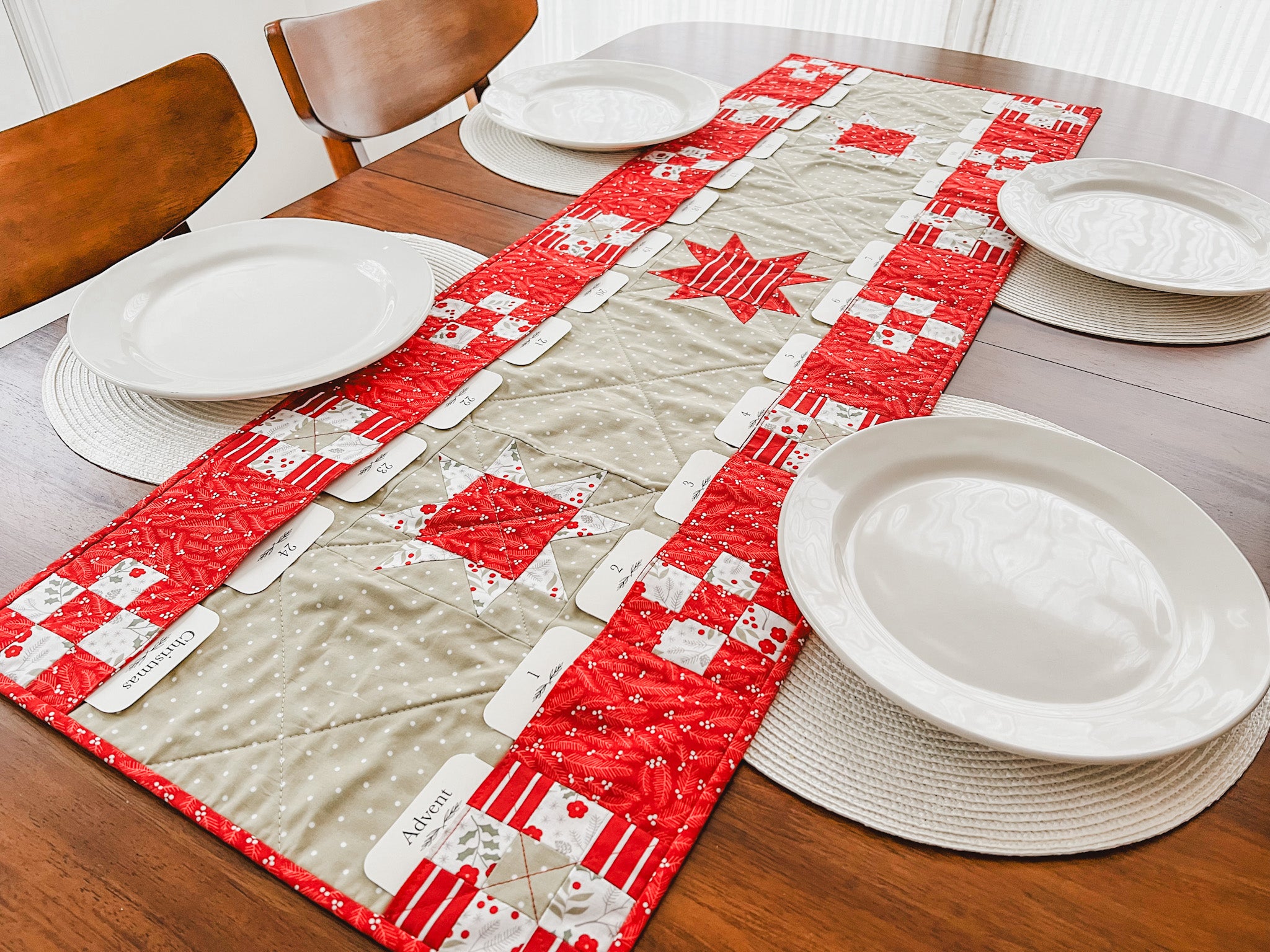 Names of Jesus Advent Cards - countdown to Christmas - Pockets Full of Blessings Quilted Table Runner Pattern Collection - shown on dining table with plates