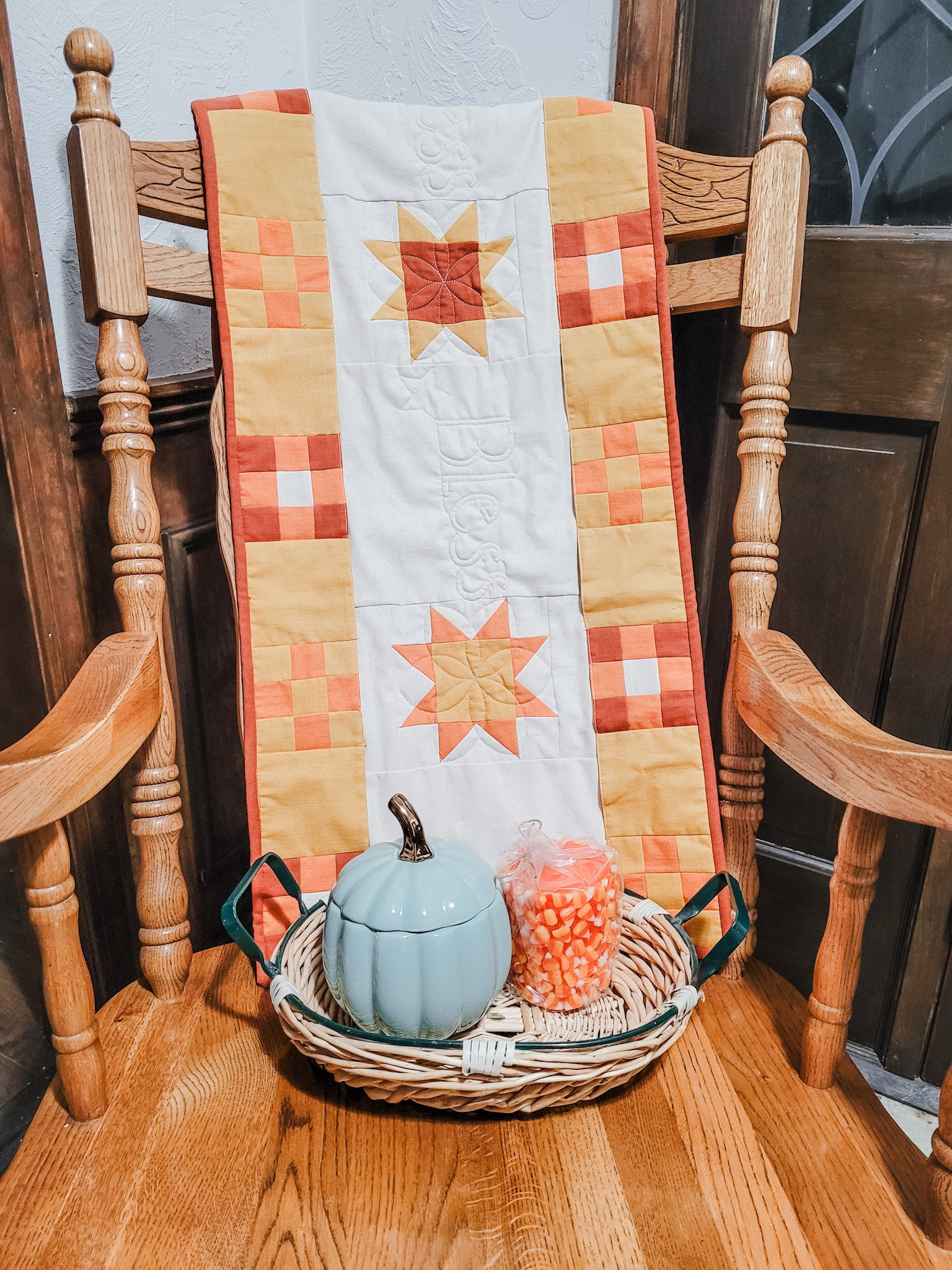 Lu's pockets full of blessings table runner draped over a rocking chair