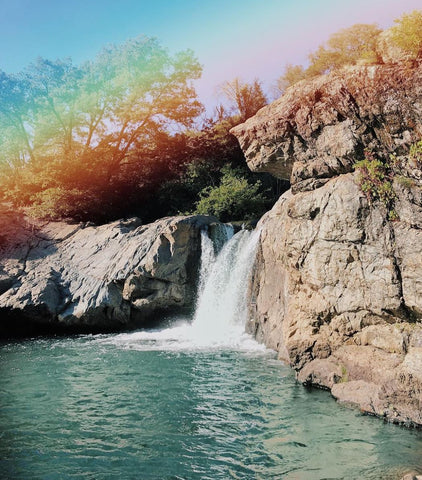 rainbow pools waterfall with rainbow in california