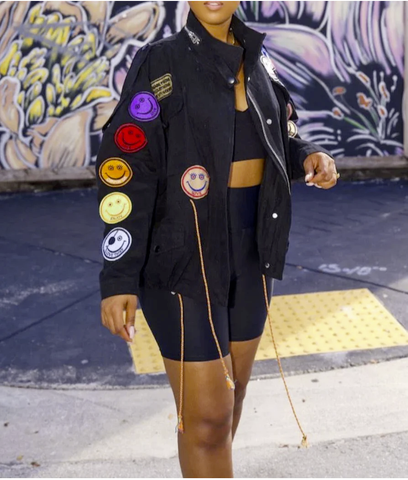 A statement patchwork jacket with smiley faces along the sleeve. 