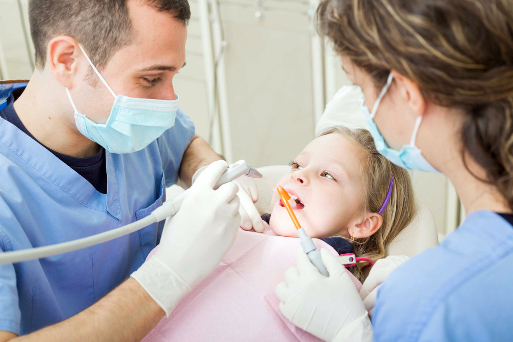 Dentists and doctors signing the My Friends and I book