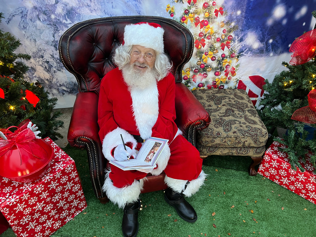 Santa signing the My Friends and I book