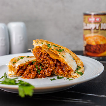 A toasted snack filled with beef, onions and tomato sauce (2)