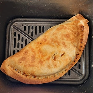 A cooked tortilla in an air fryer 