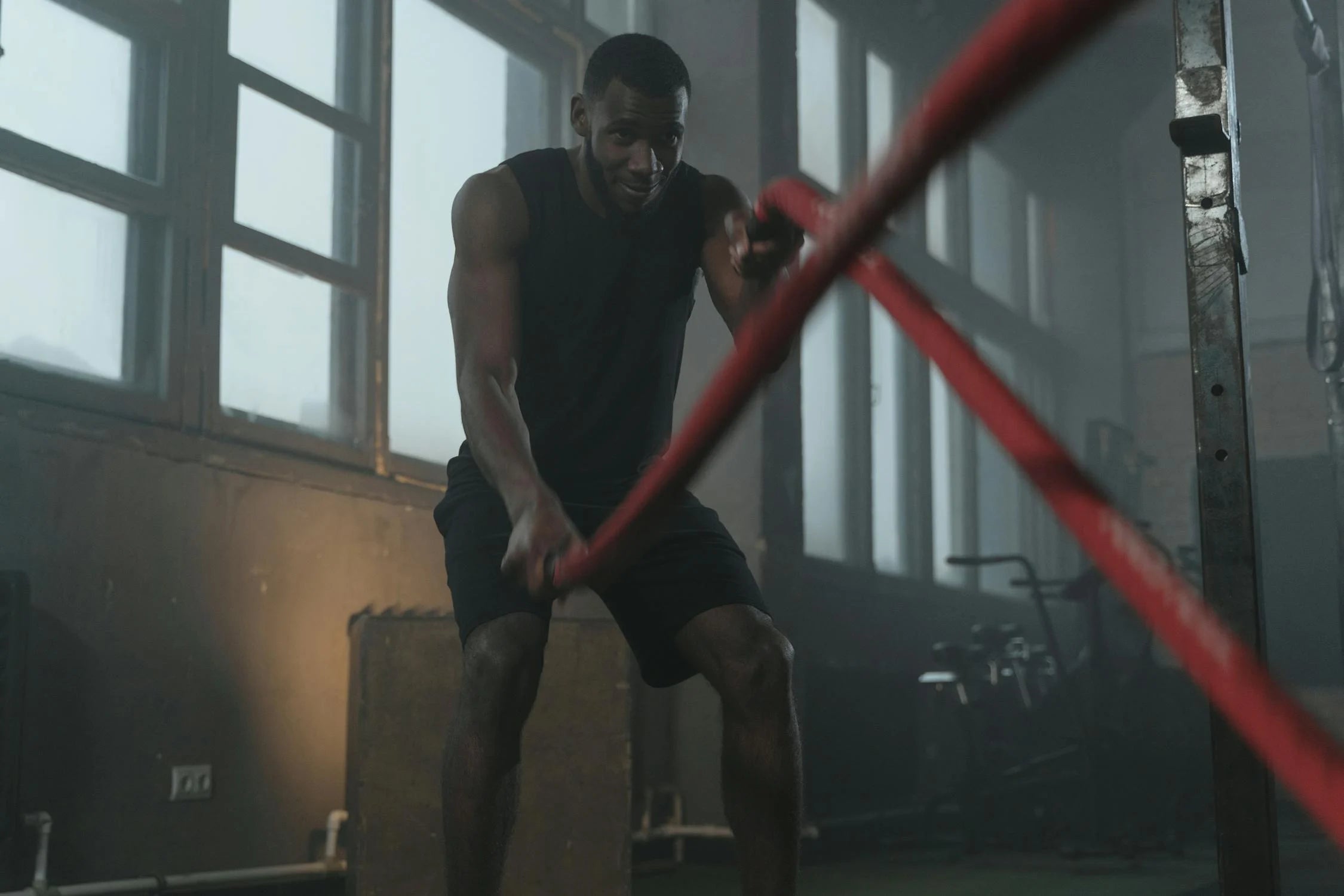 a man working out with ropes after creatine supplements