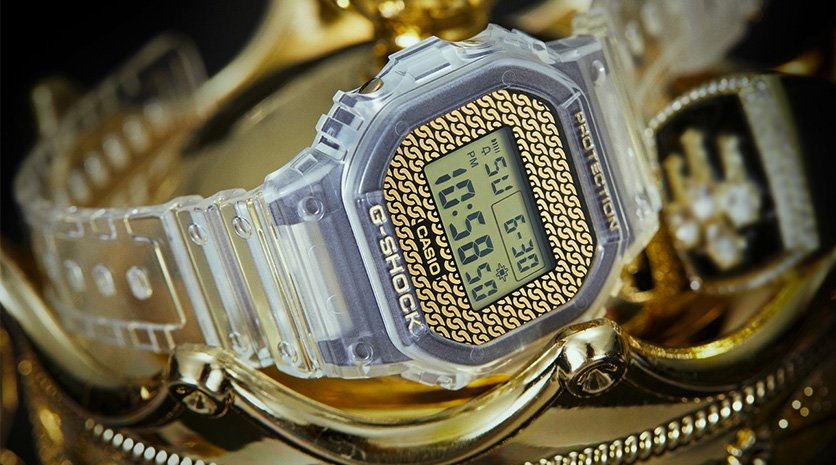Unique watches. G-Shock Gold Chain with gold curb chains in background.