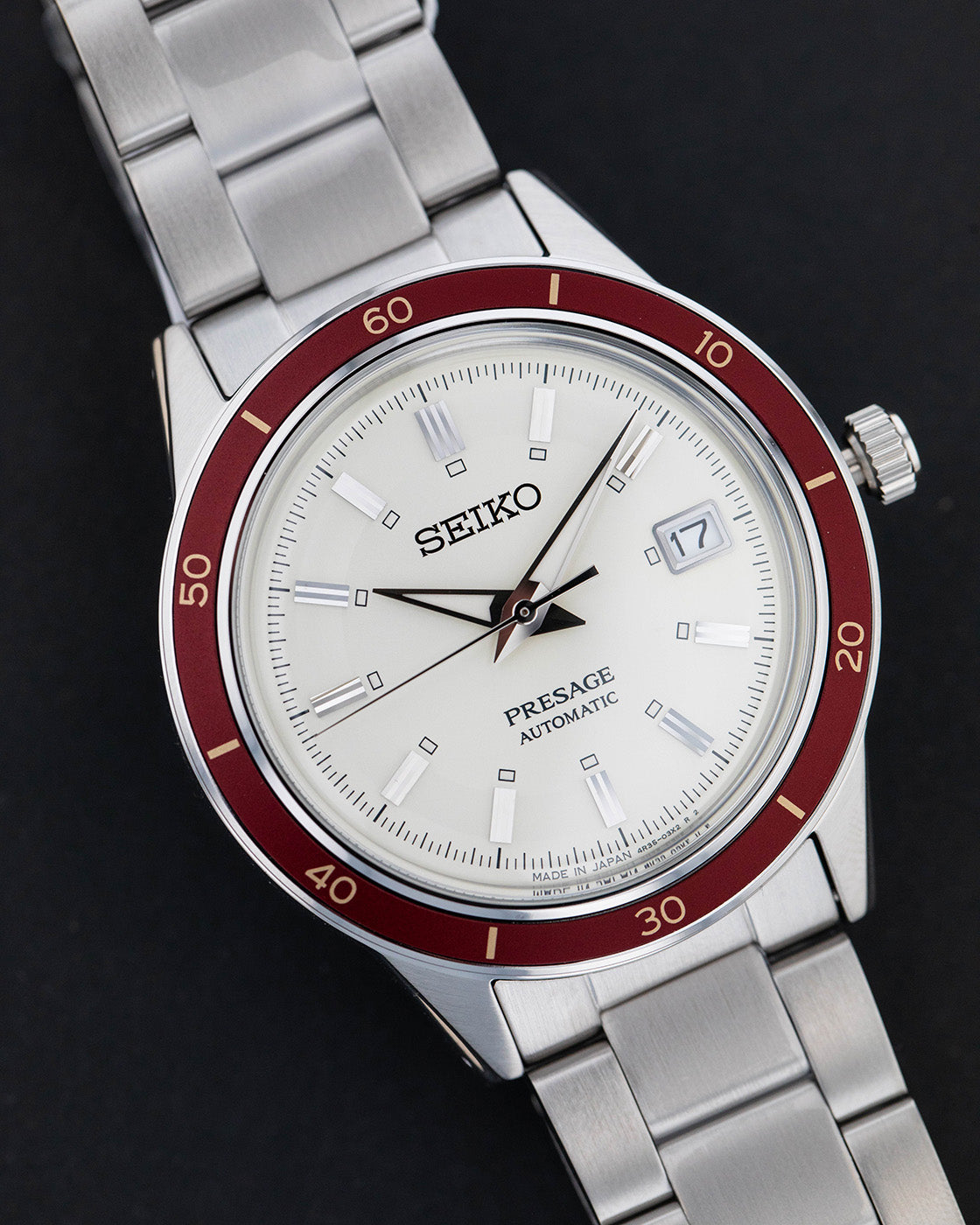 Seiko Presage SRPH93J Style 60's Mens Watch. Close-up of dial on black background.