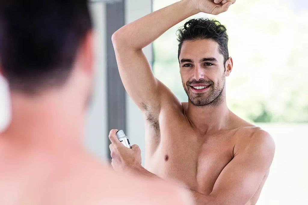 men apply deodorant