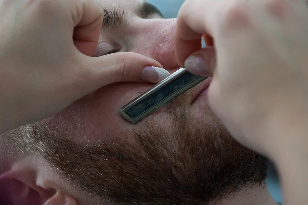 men shaving beard