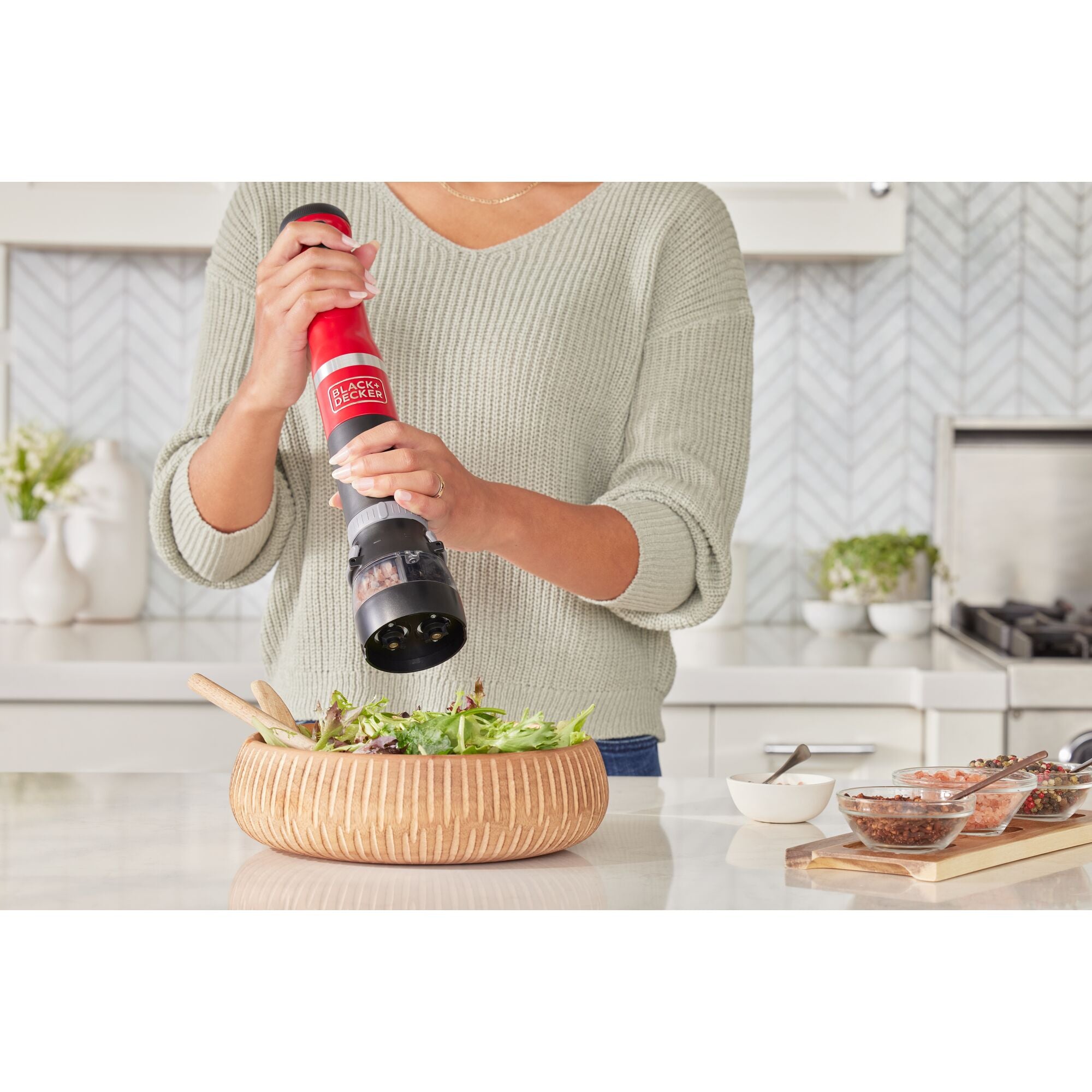 Grey, BLACK+DECKER kitchen wand Salt and pepper grinder attachment resting on the kitchen countertop