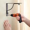 BLACK+DECKER Cordless Screwdriver with Pivoting Handle is fixing the screw in the wall.