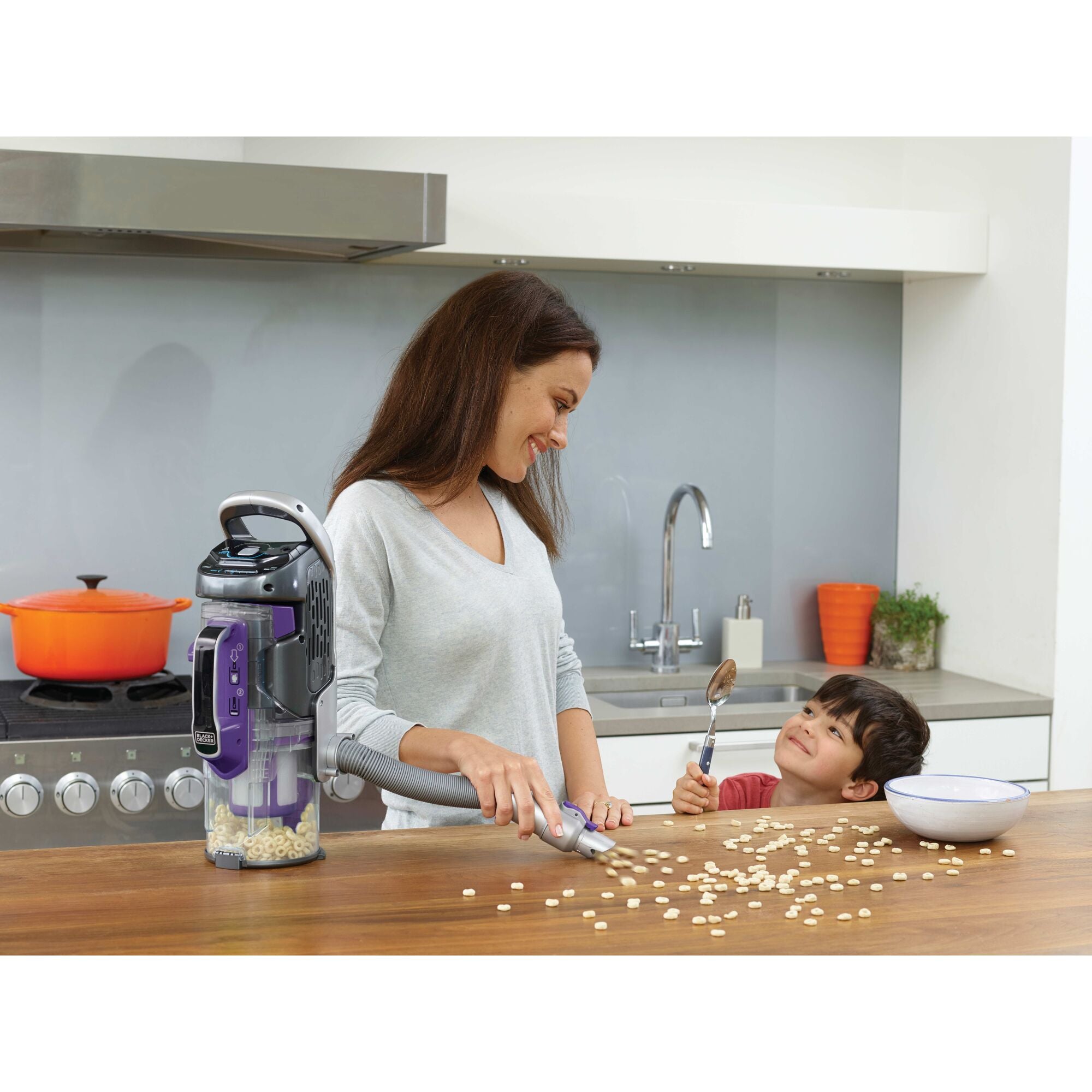 Power Series pro cordless 2 in 1 pet vacuum being used by a person to clean floor.