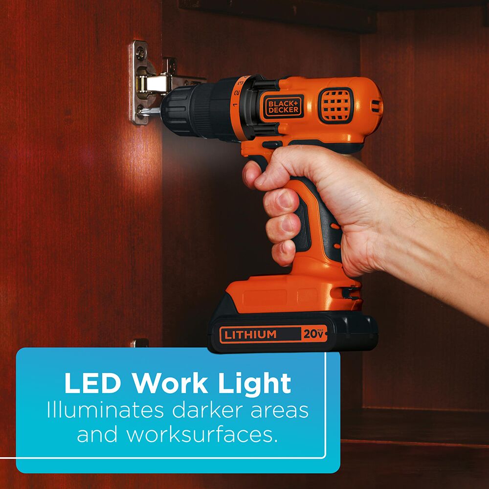 Person using a Black and Decker 20 volt max lithium ion cordless drill/driver with LED work light to drive a screw into a cabinet door