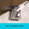 A person cleans under a sofa with the BLACK+DECKER Floor Sweeper, 50 Minutes Runtime. 360° swiveling head.
