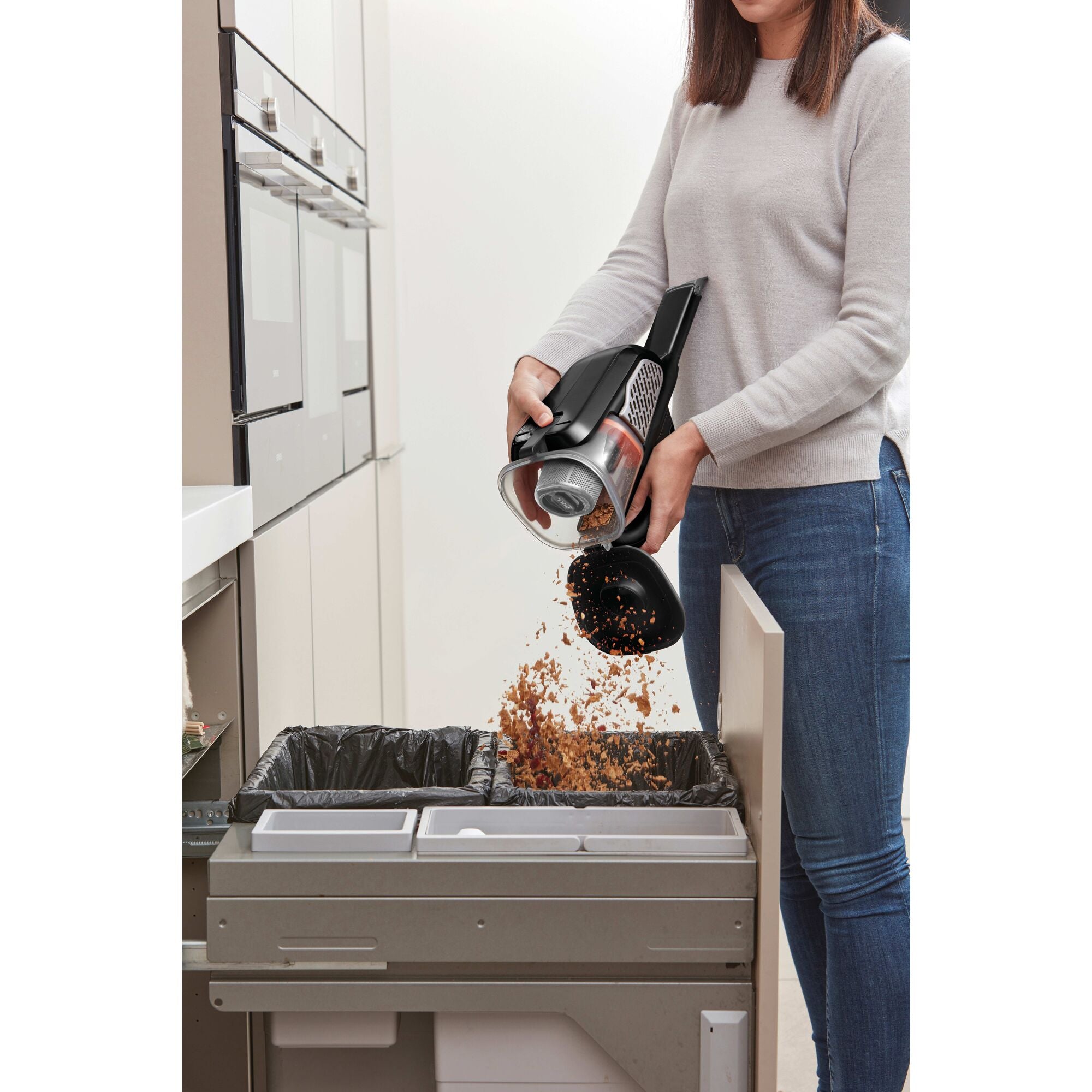 Dustbuster Advanced Clean plus Cordless Hand Vacuum being used for cleaning car mat.