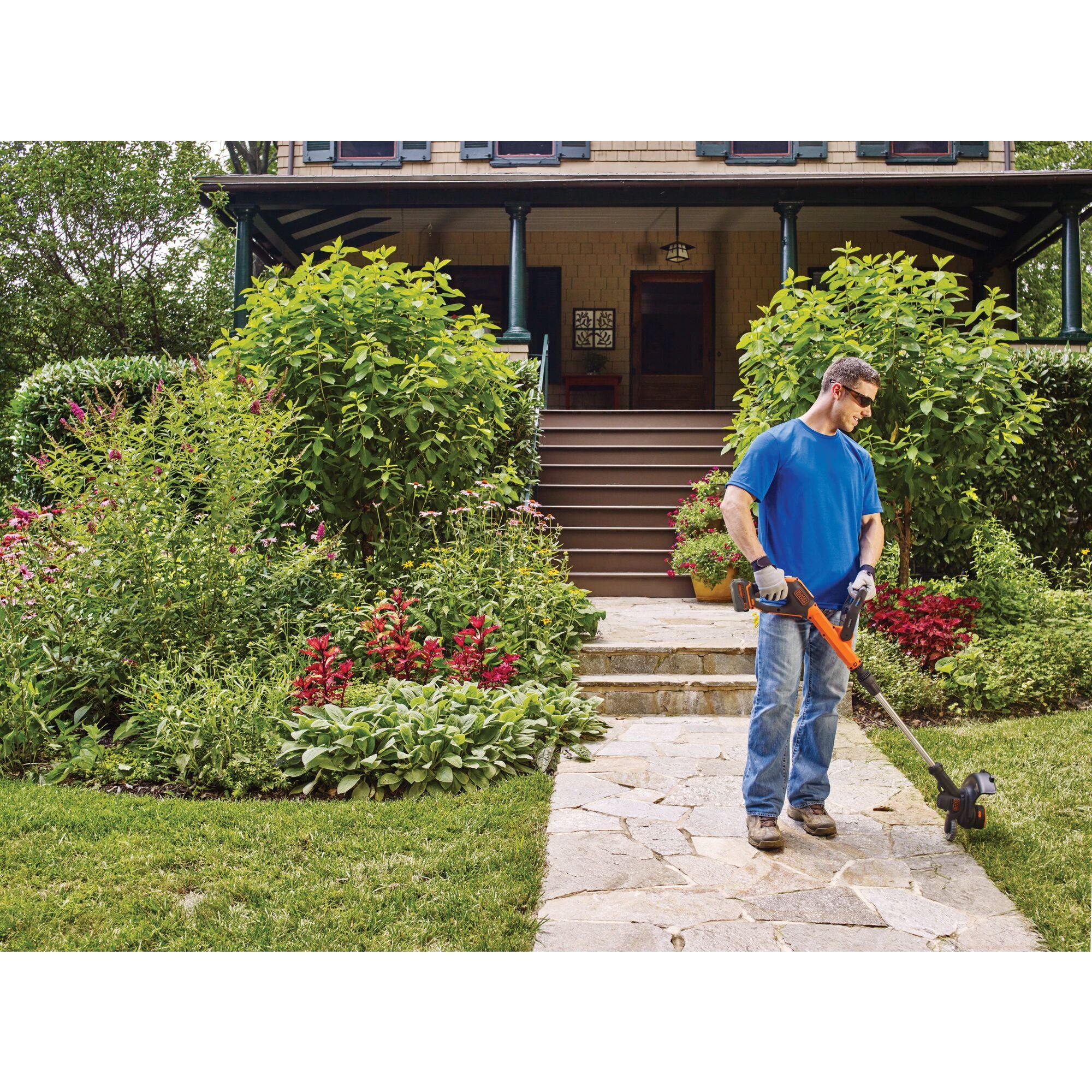 20 volt MAX lithium EASYFEED string trimmer edger being used by a person to trim grass.